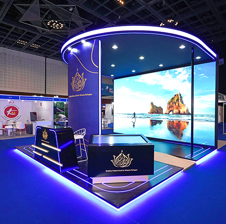 Exhibition stand with curved LED video wall and blue perimeter lighting