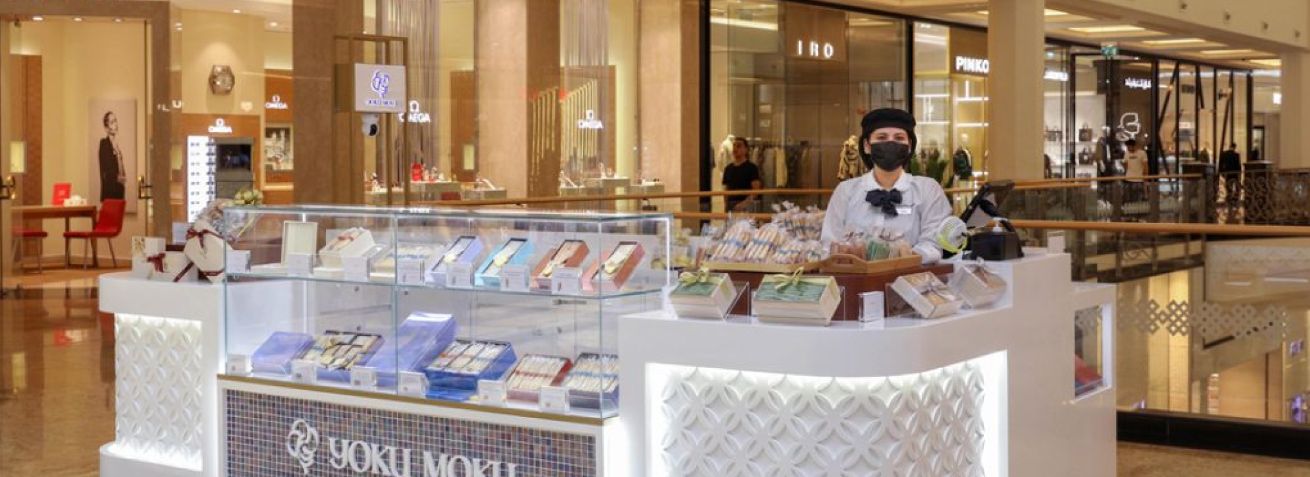 Yoku Moku retail kiosk in a Dubai mall with illuminated display cabinet