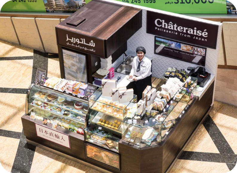 Emaar sales kiosk with faceted white counter and brochure display