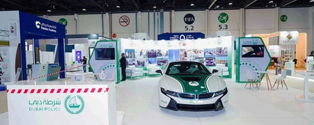 Dubai Police stand displaying a green BMW i8 patrol car